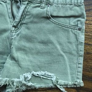 BDG Green denim distressed shorts.